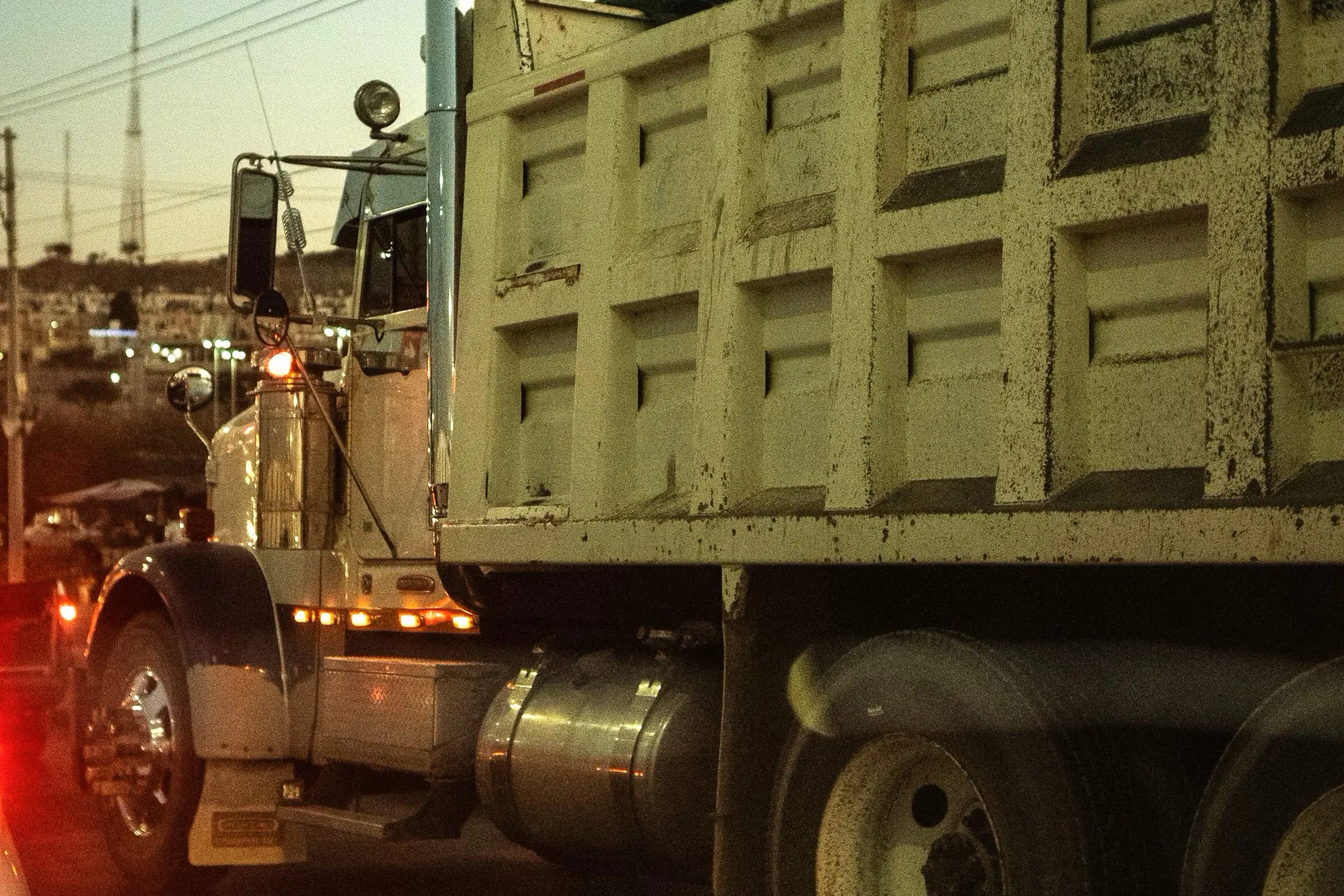 A dump truck unloading gravel